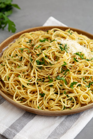 Homemade Italian Spaghetti Aglio e Olio on a Plate, side view.の写真素材