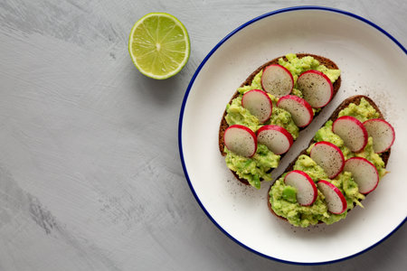 Homemade Radish Avocado Toast with Salt and Pepper on a Plate, top view. copyspace.の写真素材