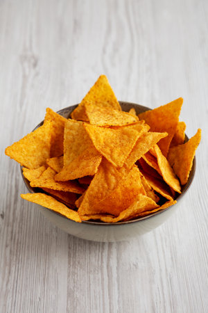 Mexican Chili Tortilla Chips in a bowl, side view.
