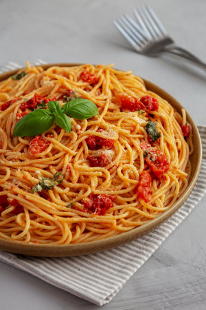 Homemade Spaghetti With Fresh Tomato Sauce on a Plate, side view.の写真素材