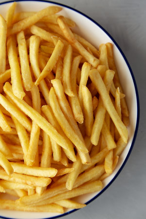 Homemade French Fries on a Plate, top view. Flat lay, overhead, from above. close-up.