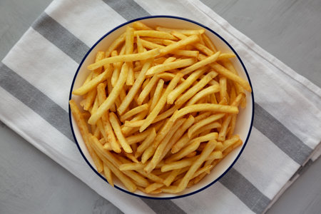 Homemade French Fries on a Plate, top view. Flat lay, overhead, from above.