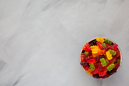 Colorful Fruity Gummy Bears in a Bowl, top view. Space for text.の写真素材