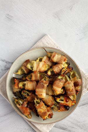 Homemade Bacon-Wrapped Jalapeno Poppers on a Plate, top view. Copy space.の写真素材