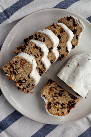 Homemade Christmas Stollen Bread on a Plate, top view. Flat lay, overhead, from above.