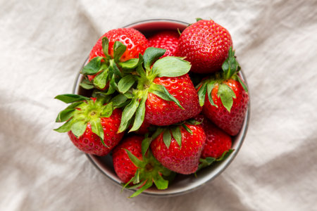 Organic Red Strawberries in a Bowl, top view. Flat lay, overhead, from above.の写真素材