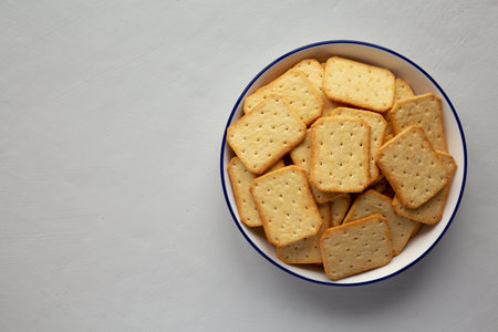 Oven Baked Crackers on a Plate, top view. Flat lay, overhead, from above. Copy space.の写真素材