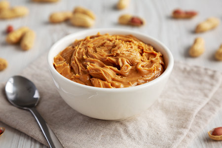 Organic Raw Peanut Butter in a Bowl, side view.