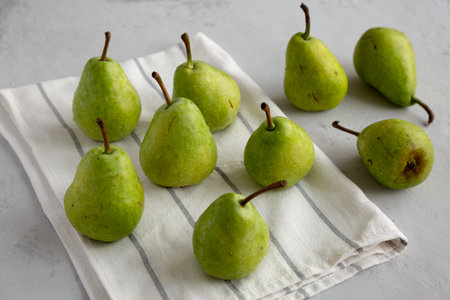 Raw Organic Lucas Pears in a Bunch, side view.
