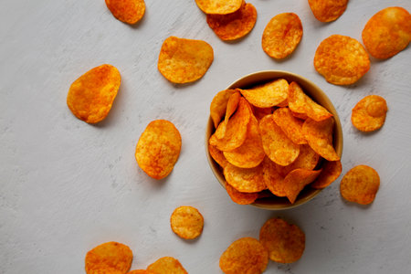 Homemade Flavored Paprika Potato Chips in a Bowl, top view. Flat lay, overhead, from above.の写真素材