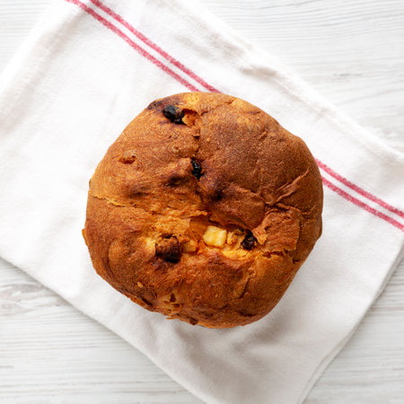 Homemade Italian Panettone Bread with Dried Fruit, top view. Flat lay, overhead, from above.