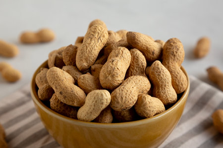 Organic Raw Peanuts in a Bowl, low angle view.
