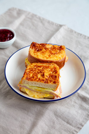 Homemade French Monte Cristo Sandwich with Raspberry Jam, side view.