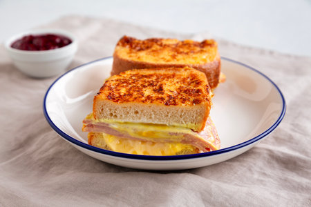 Homemade French Monte Cristo Sandwich with Raspberry Jam, side view. Close-up.