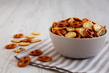 Homemade Salty Party Snack Mix in a Bowl, side view.の写真素材