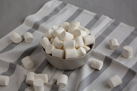 Soft White Marshmallows in a Bowl, side view.の写真素材
