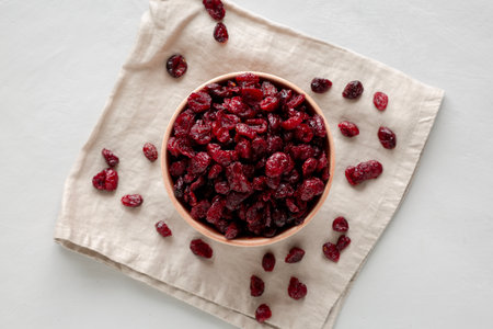 Organic Dried Cranberries in a Bowl, top view. Flat lay, overhead, from above.の写真素材