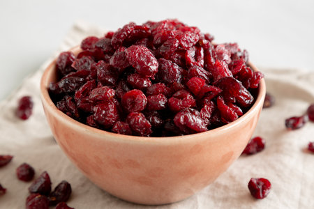 Organic Dried Cranberries in a Bowl, side view. Close-up.の写真素材
