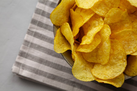 Homemade Kettle Cooked Potato Chips with Salt in a Bowl, top view.の写真素材