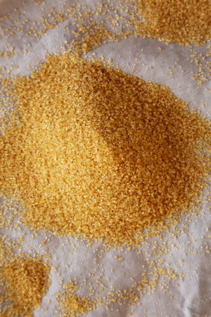 Demerara Sugar on a white cloth, top view.の写真素材