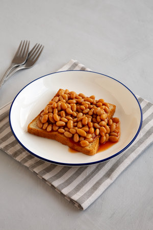 Homemade English Beans on Toast, side view.の写真素材