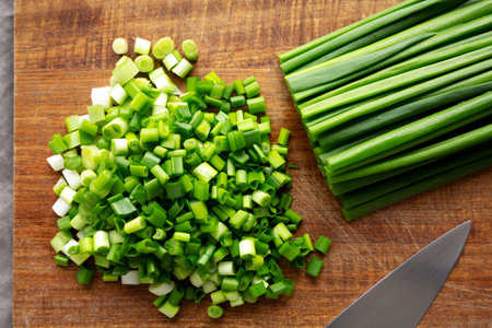 Organic Cut Green Onion Scallions on a Wooden Board, top view.の写真素材