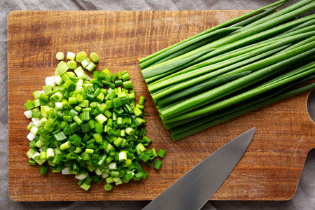 Organic Cut Green Onion Scallions on a Wooden Board, top view.の写真素材