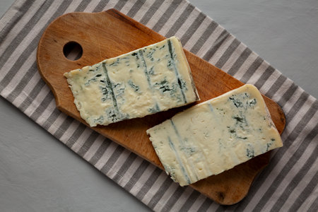 Blue cheese Gorgonzola on a Wooden Board, top view.の写真素材