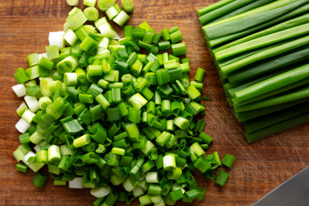 Organic Cut Green Onion Scallions on a Wooden Board, top view.の写真素材