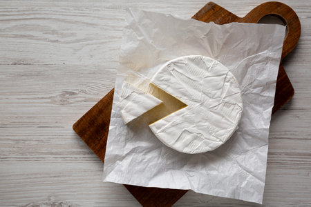 Homemade White Brie Cheese on a Wooden Board, top view. Copy space.の写真素材