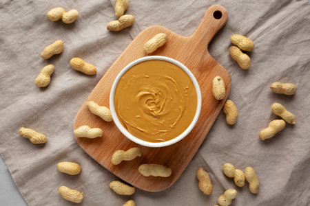 Organic Peanut Butter in a Bowl, top view. Flat lay, overhead.の写真素材