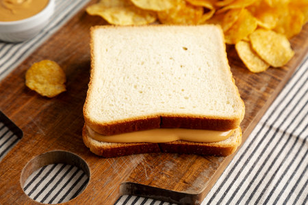 Homemade American Peanut Butter Sandwich on a Wooden Board, side view.の写真素材
