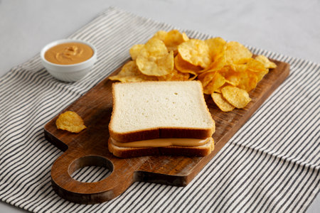 Homemade American Peanut Butter Sandwich on a Wooden Board, side view.の写真素材