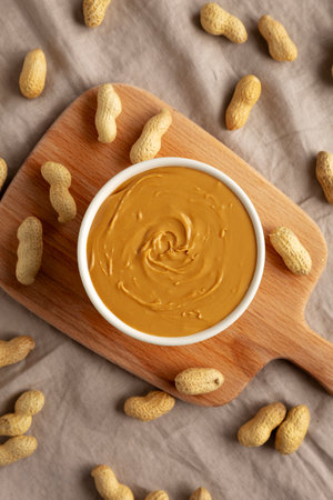Organic Peanut Butter in a Bowl, top view. Flat lay, overhead.の写真素材