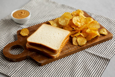 Homemade Peanut Butter Sandwich on a Wooden Board, side view.の写真素材
