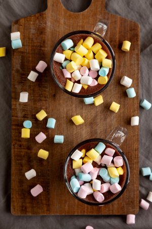 Warm Chocolate Cocoa in Mugs with Colorful Marshmallows, top view. Overhead, from above.の写真素材