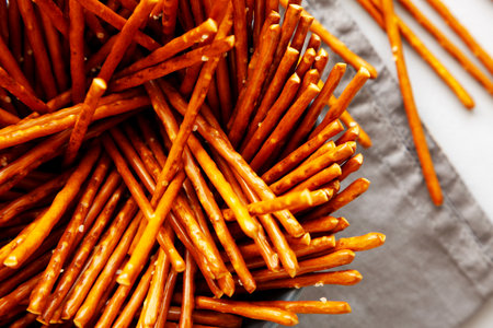 Organic Salty Pretzel Sticks in a Bowl, top view. Close-up.の写真素材