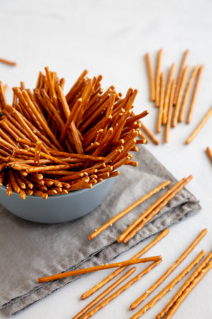 Organic Salty Pretzel Sticks in a Bowl, side view.の写真素材