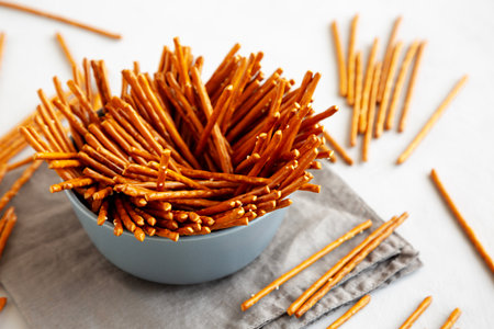 Organic Salty Pretzel Sticks in a Bowl, side view.の写真素材