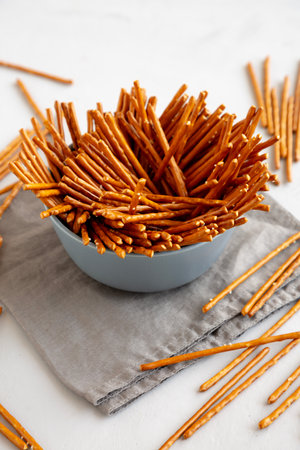 Organic Salty Pretzel Sticks in a Bowl, side view.の写真素材