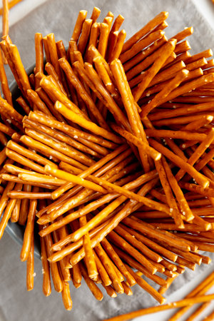 Organic Salty Pretzel Sticks in a Bowl, top view.の写真素材