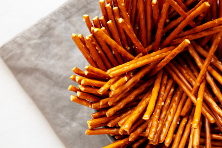 Organic Salty Pretzel Sticks in a Bowl, top view. Copy space.の写真素材