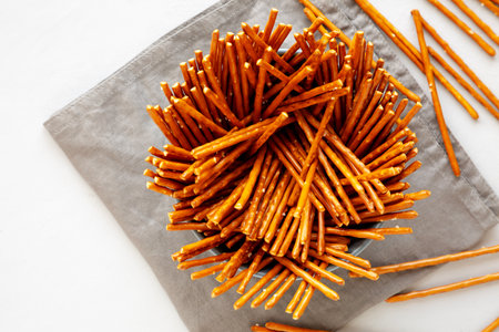 Organic Salty Pretzel Sticks in a Bowl, top view. Space for text.の写真素材