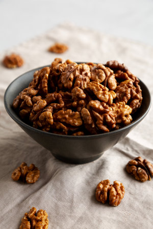 Raw Walnut Halfs in a Bowl, side view.の写真素材