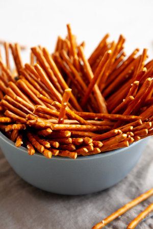 Organic Salty Pretzel Sticks in a Bowl, side view.の写真素材