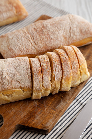 Homemade Ciabatta Bread on a wooden board, side view.の写真素材