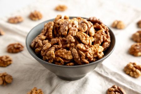 Raw Walnut Halfs in a Bowl, side view. Close-up.の写真素材