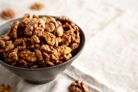 Raw Walnut Halfs in a Bowl, side view. Copy space.の写真素材