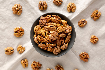 Raw Walnut Halfs in a Bowl, top view.の写真素材