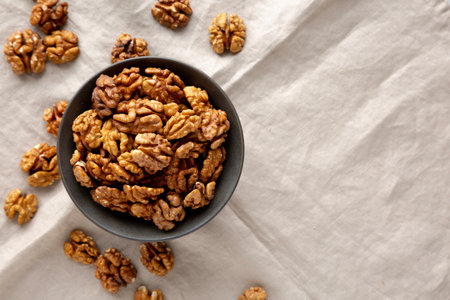 Raw Walnut Halfs in a Bowl, top view. Copy space.の写真素材